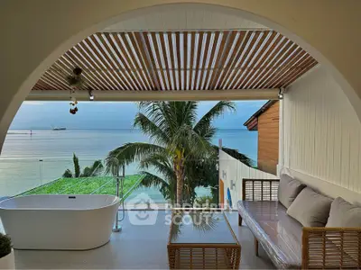 Stunning beachfront balcony with ocean view and luxurious bathtub