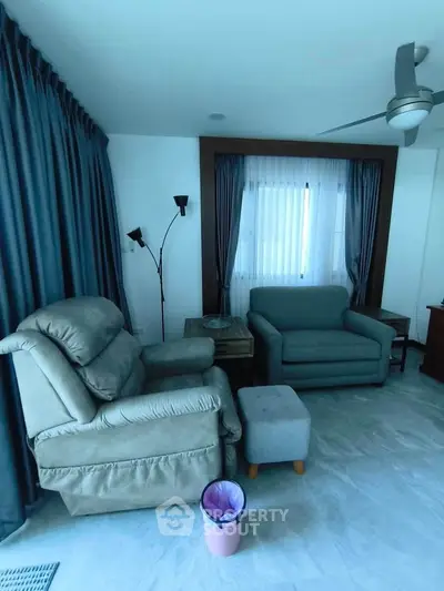 Cozy living room with plush seating and modern decor, perfect for relaxation.