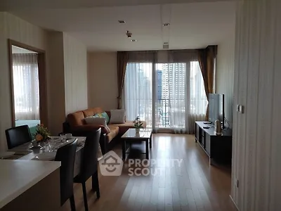 Spacious living room with modern decor and city view, perfect for urban living.
