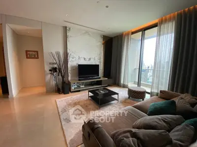 Luxurious living room with modern decor and large balcony view
