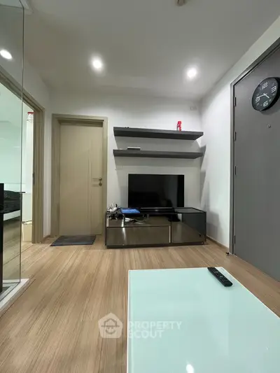 Modern living room with sleek design and wooden flooring