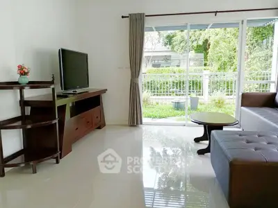 Bright living room with garden view and modern furniture