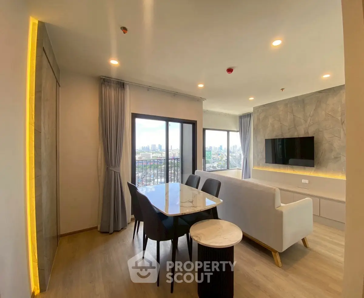 Modern living room with city view, stylish furniture, and elegant lighting