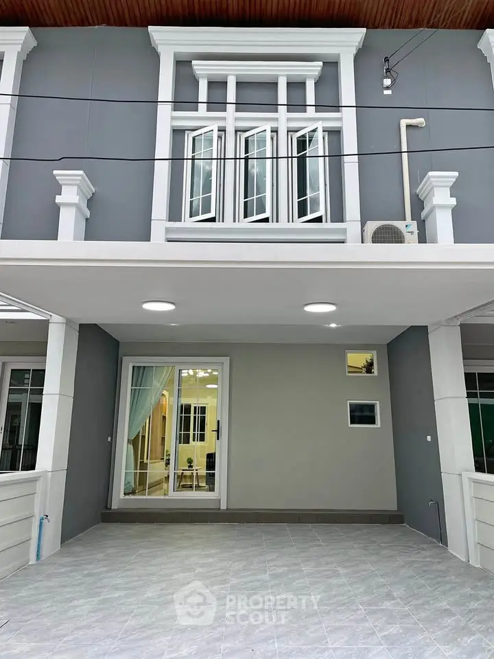Modern townhouse exterior with sleek design and spacious entrance