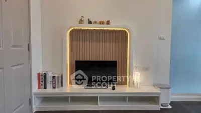 Modern living room with stylish TV unit and ambient lighting