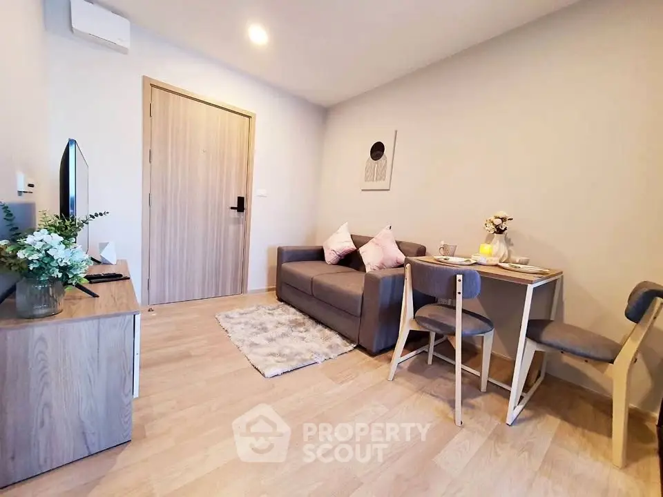 Cozy modern living room with stylish decor and compact dining area