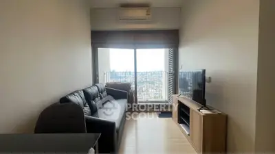 Modern living room with city view, sleek black sofa, and large window for natural light.