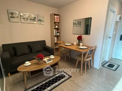 Charming living room with cozy seating and elegant dining area, perfect for modern living.