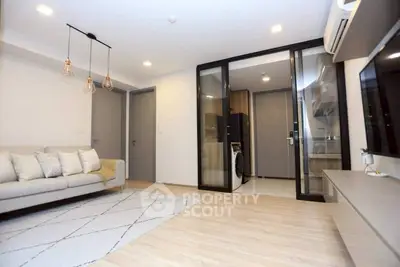 Modern living room with open kitchen and stylish lighting