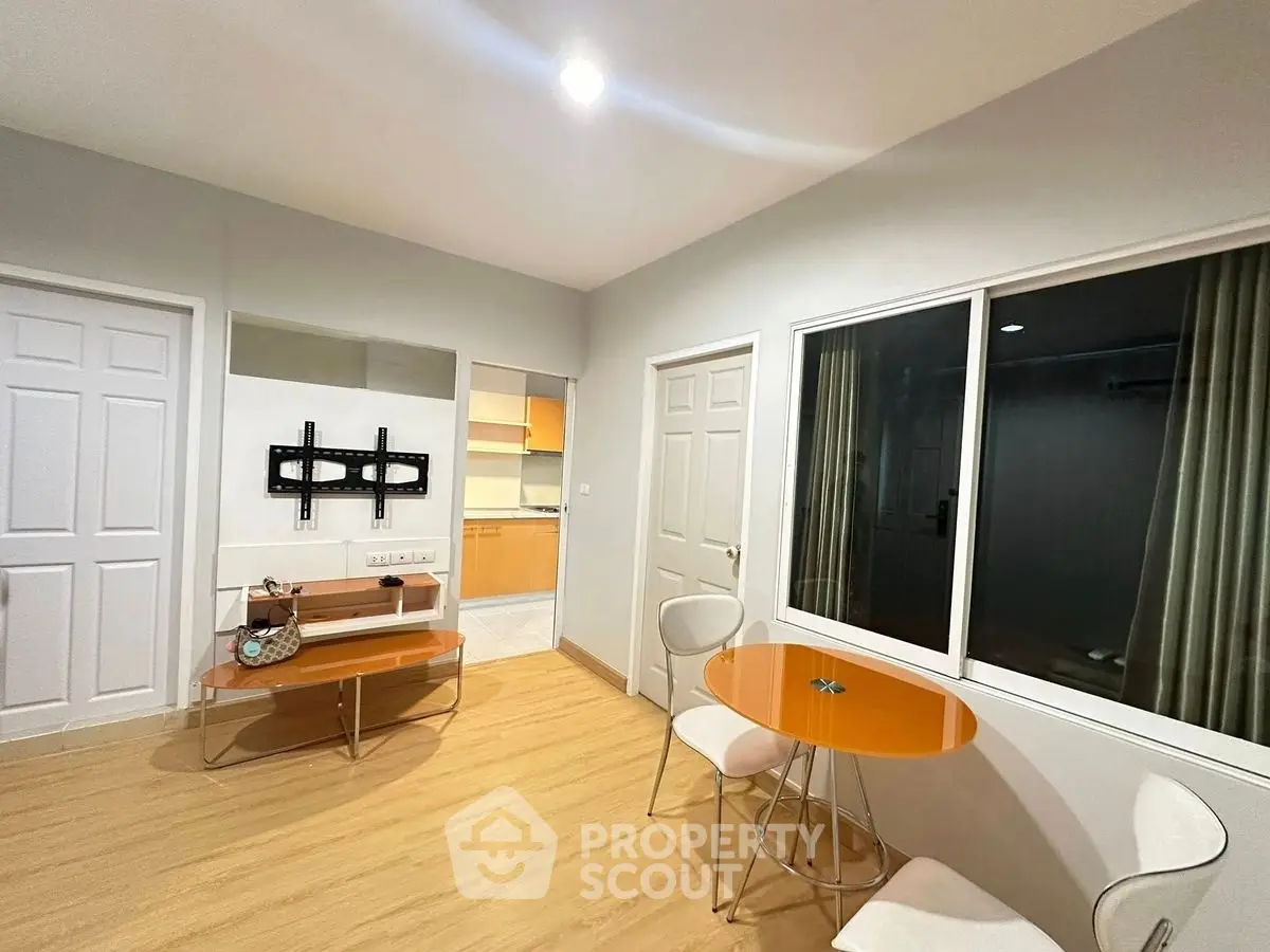 Modern living room with stylish furniture and open kitchen view