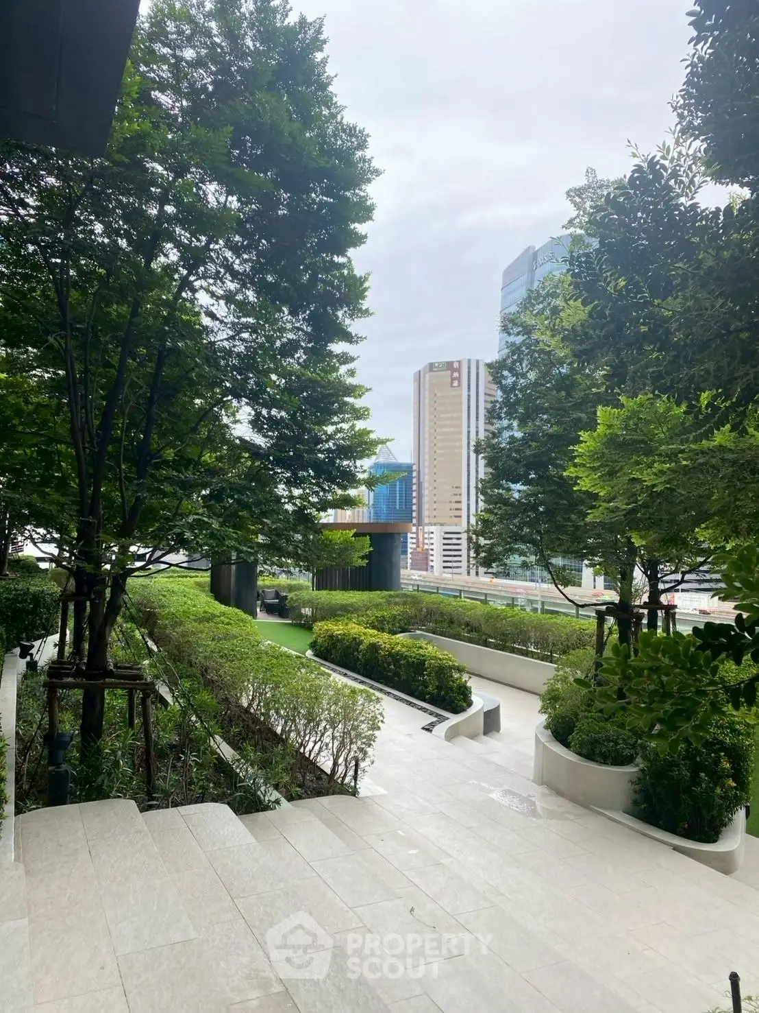 Luxurious urban garden with lush greenery and city skyline view