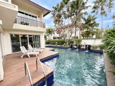 Luxurious villa with private pool and lush garden, perfect for relaxation and entertainment.