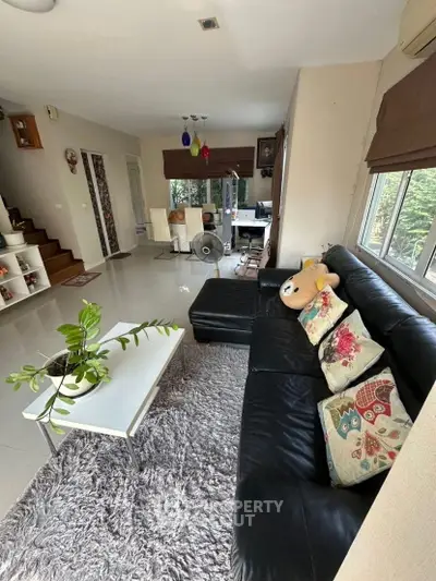 Spacious living room with modern decor and cozy seating area