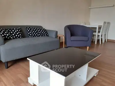 Modern living room with stylish furniture and wooden flooring
