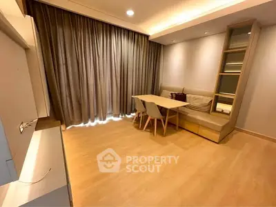 Modern living room with elegant wooden flooring and cozy dining area