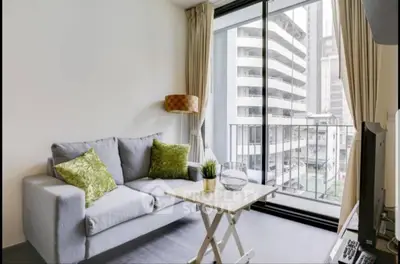Modern living room with balcony view in urban apartment