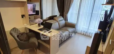 Modern living room with cozy sofa, work desk, and large windows with curtains.