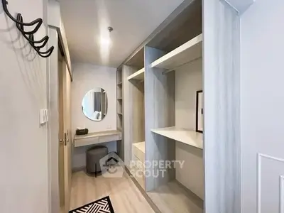 Spacious walk-in closet with modern design and ample storage space.