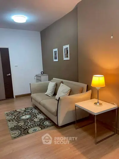 Cozy living room with modern sofa and warm lighting