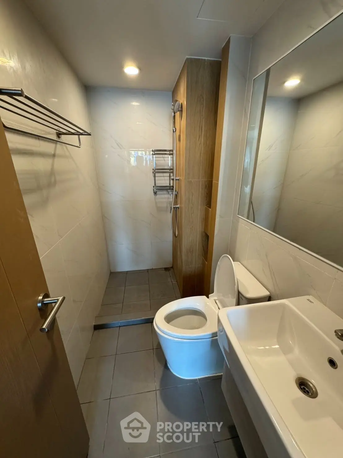 Modern bathroom with sleek fixtures and spacious shower area