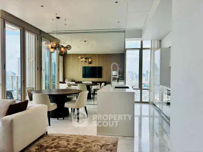 Luxurious open-plan living room with stunning city views and modern decor