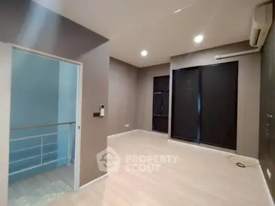 Spacious modern living room with sleek design and natural light