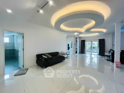 Spacious modern living room with unique ceiling design and glossy white flooring
