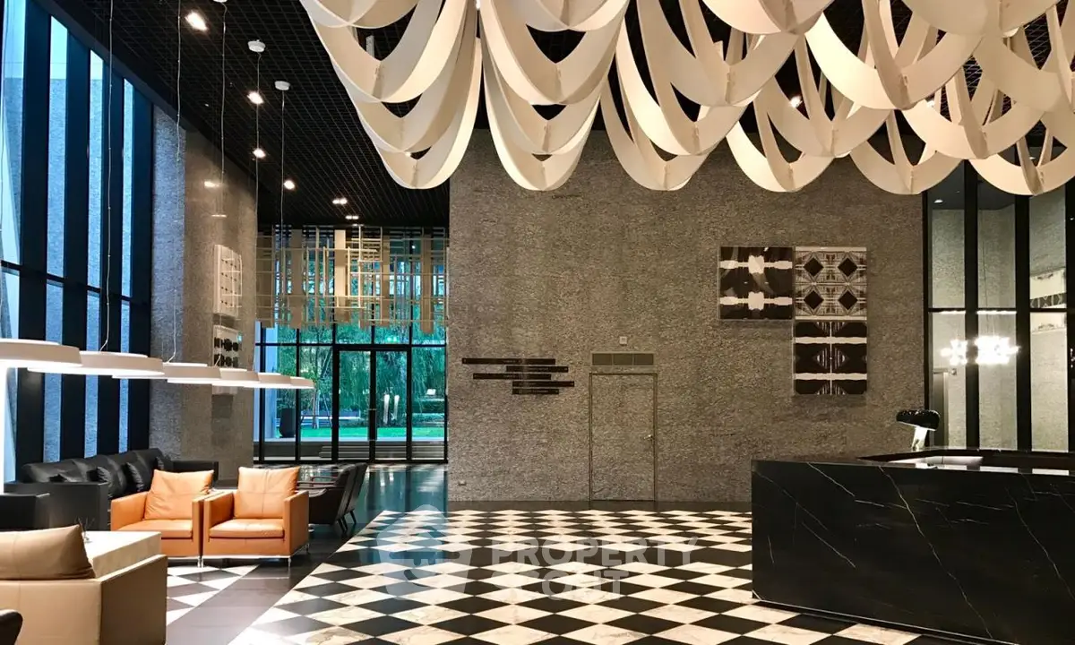 Luxurious modern lobby with high ceilings and elegant decor