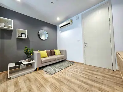 Modern living room with stylish decor and wooden flooring