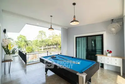 Spacious balcony with pool table and scenic view, perfect for entertainment and relaxation.