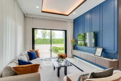 Modern living room with stylish decor and large window view