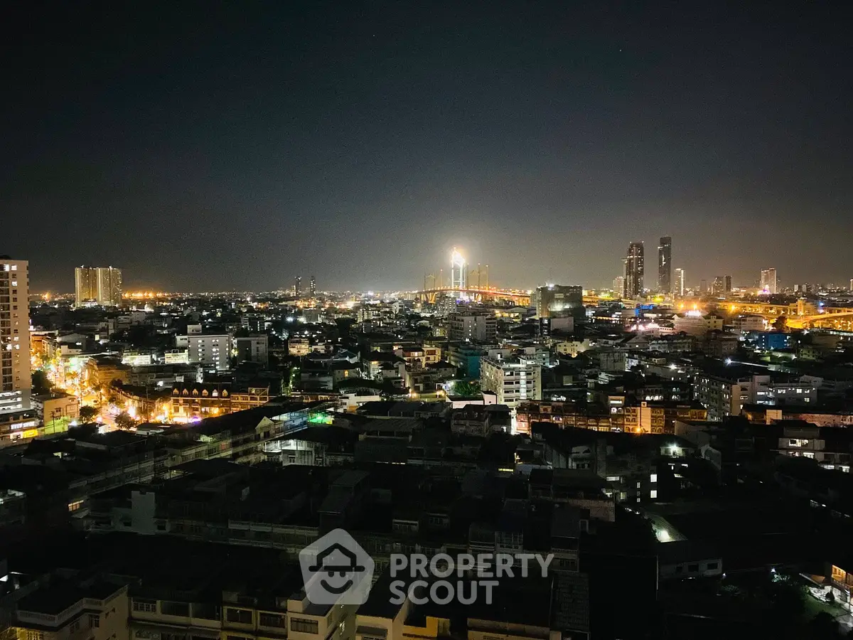 Stunning cityscape night view with illuminated skyline and vibrant city lights.