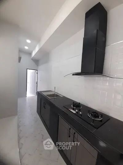 Sleek modern kitchen with gas stove and stylish cabinetry
