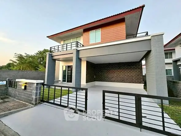 Modern two-story house with spacious driveway and contemporary design.