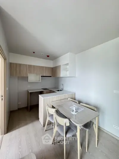 Modern kitchen with open layout and dining area in minimalist design