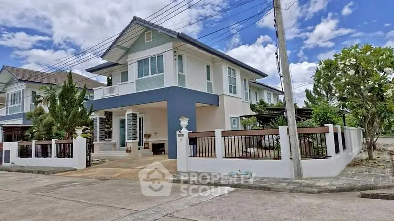 Charming two-story house with modern design and spacious outdoor area in a serene neighborhood.