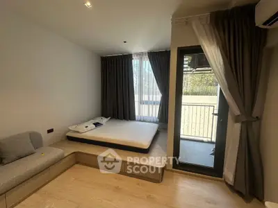 Modern bedroom with balcony access and stylish decor