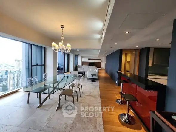 Luxurious open-plan living and dining area with city views and modern decor.