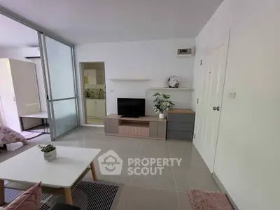 Modern living room with sleek furniture and open layout in a stylish apartment.