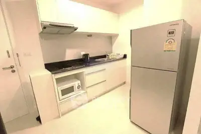 Modern kitchen with sleek appliances and ample storage space