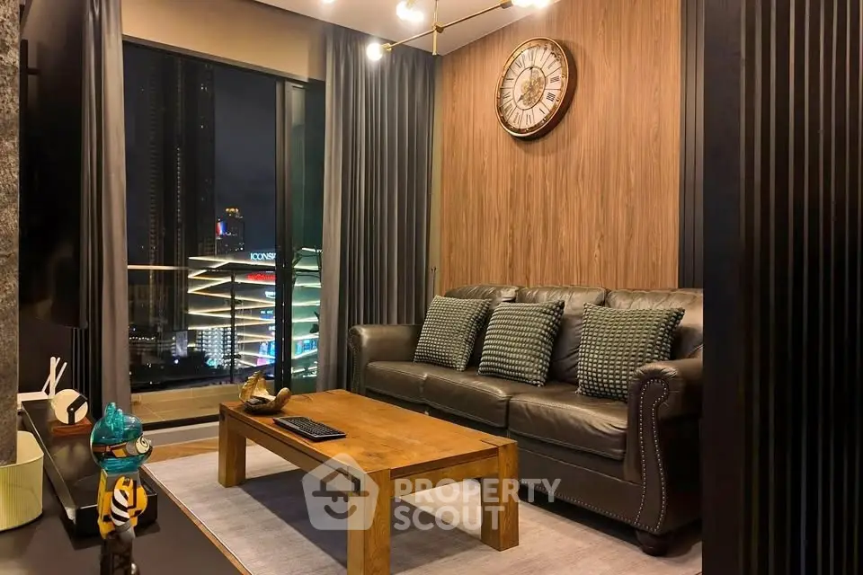 Luxurious living room with city view, elegant decor, and cozy ambiance.