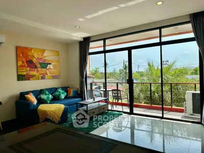 Spacious living room with vibrant decor and balcony view in modern apartment