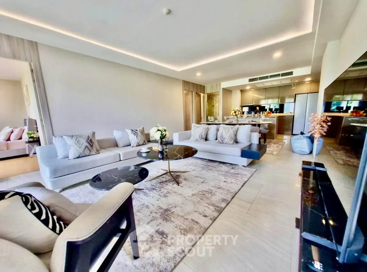 Spacious modern living room with elegant decor and open kitchen layout