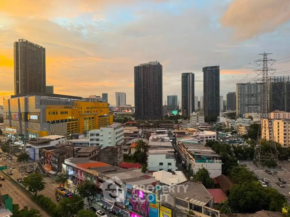 Stunning cityscape view with modern skyscrapers and vibrant sunset sky, perfect for urban living enthusiasts.