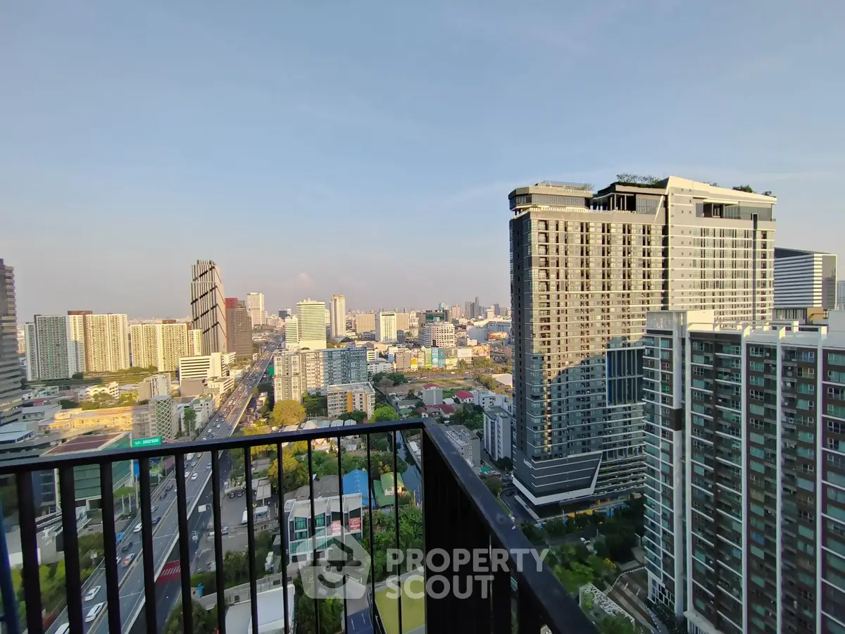 Stunning cityscape view from high-rise balcony in urban setting
