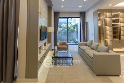 Luxurious modern living room with elegant furniture and large window view