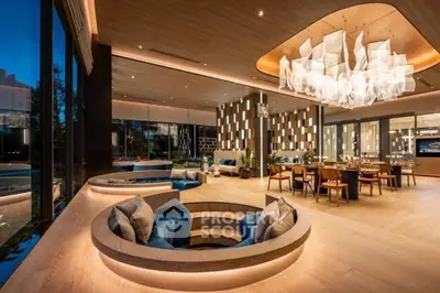 Luxurious modern living room with unique sunken seating and elegant lighting