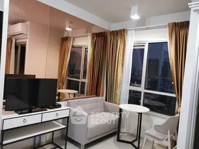 Modern living room with city view, featuring sleek furniture and large windows for natural light.