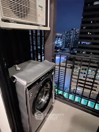 City view balcony with washing machine and air conditioning unit