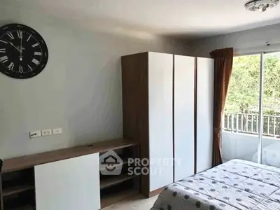 Cozy bedroom with modern wardrobe and balcony view